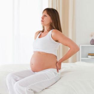 zakaj bolečine v hrbtu med nosečnostjo