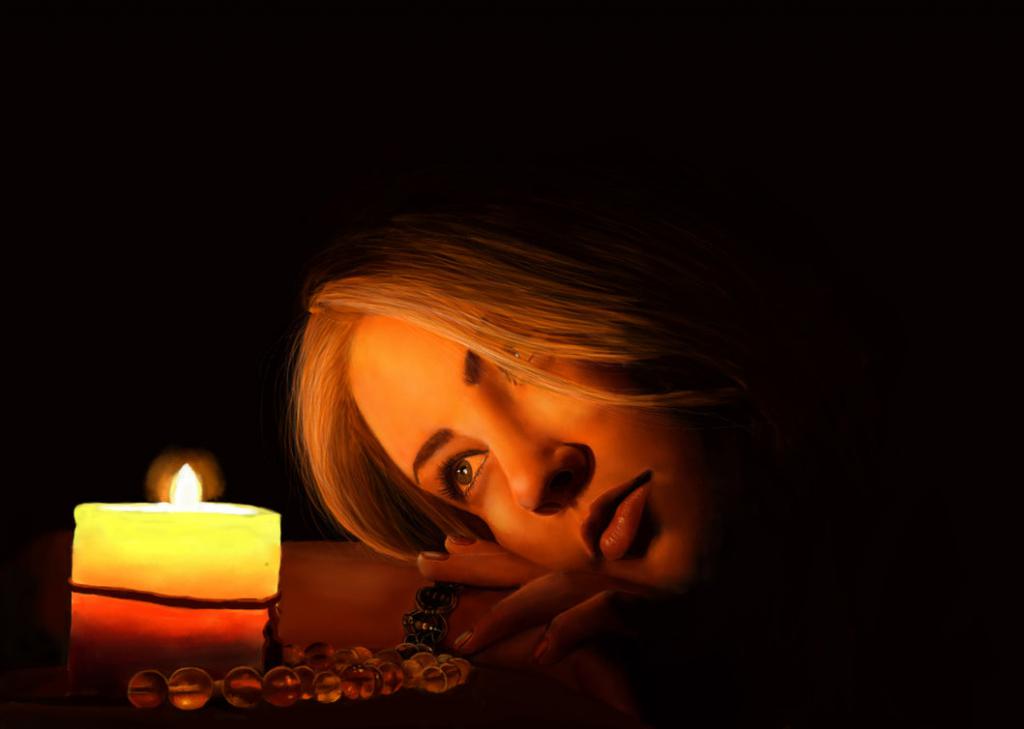 dívka se dívá na svíčku