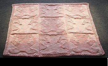maglia di un tappeto con ferri da calza